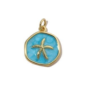 Detailed view of a gold starfish charm with light blue glitter enamel for DIY jewelry