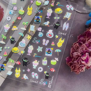 Detailed macro of 3D embossed nail stickers with summer ocean and cat motifs