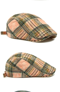 Detail showing pink and green plaid cotton fabric and adjustable side metal buckle