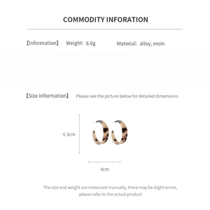 Detailed view of brown resin C-shape hoop earrings with specific size dimensions shown