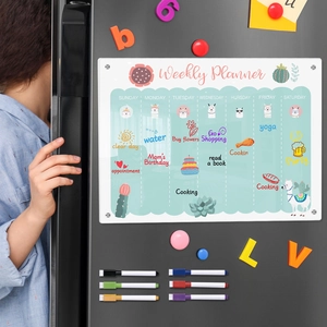 Close-up of clear acrylic weekly planner on black fridge with 8 colorful magnetic markers
