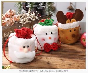 Plush Christmas drawstring gift bags with Santa, Snowman and Reindeer on wood