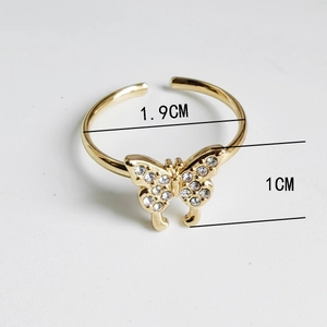 Golden butterfly open ring detail with measurements and sparkling zircon butterfly motif