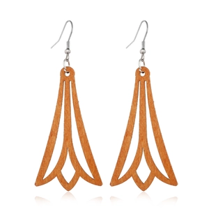 Detailed view of hollow geometric brown wood earrings with silver hooks on white background