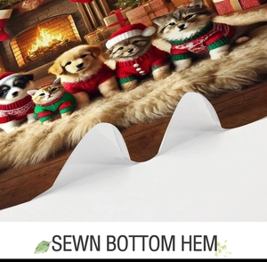 Detail view of the sewn bottom hem and festive Christmas pattern on the textile curtain