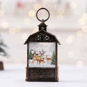 Bronze Christmas lantern with reindeer snow scene and festive warm bokeh lighting