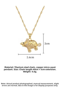 Macro view of gold elephant pendant with crystal pavé and detailed dimensions