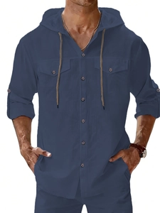 Detail of dark blue linen hooded shirt featuring button placket and chest pockets