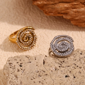 Minimalist spiral 18K gold plated ring with micro-pave diamonds on a natural stone base