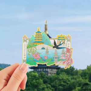 Detail of Hangzhou West Lake metal fridge magnet with Leifeng Pagoda and lotus motif
