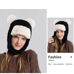 Winter plush trapper hat with white fluffy ears and contrast black and white faux fur