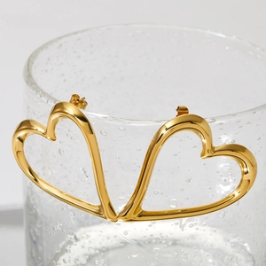 Elegant gold hollow heart earrings in polished stainless steel with mirror finish