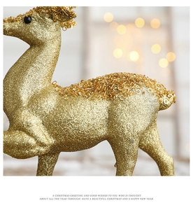 Macro detail of golden glitter Christmas reindeer with sparkling sequins and bead decorations