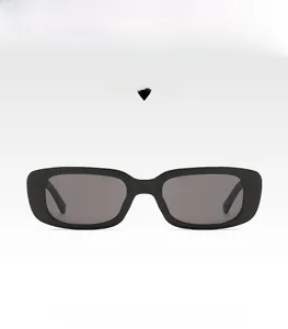 Detailed view of vintage black square sunglasses with grey lenses on light background