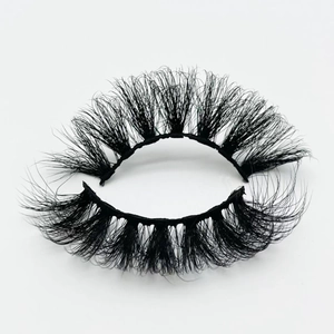 Macro shot of 20mm fluffy faux mink eyelashes with dense layered volume on white background