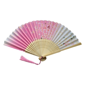 Japanese style folding fan with pink cherry blossom pattern on bamboo frame and tassel