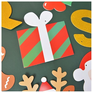 Flat lay of festive Christmas party decorations with Santa, reindeer and glitter letters
