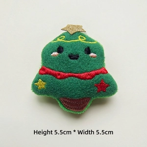 Detailed view of a green plush Christmas tree patch with gold stars, size 5.5 x 5.5 cm