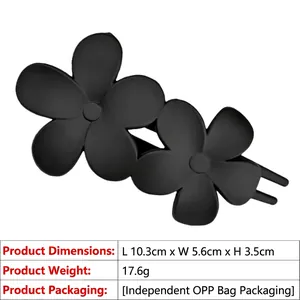 Detail view of a black matte floral hair clip showing dimensions 10.3cm and 17.6g weight