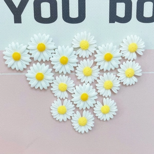 Set of 16 small resin daisy charms with white petals and yellow centers in heart shape