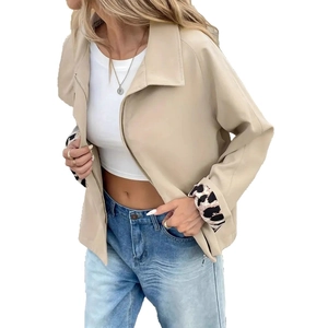 Detail of leopard print cuff lining and zipper on this elegant beige utility jacket