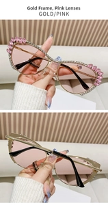 Detailed view of gold metal cat-eye sunglasses with pink lenses and rhinestone inlay