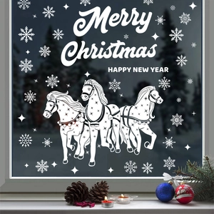 White Christmas window decals featuring horses and snowflakes on glass with holiday greetings