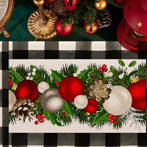 Close-up of Christmas placemat with festive patterns on a black and white plaid tablecloth