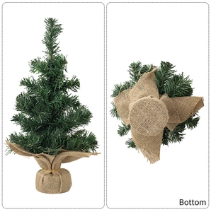 Detail view of 30cm mini Christmas tree with burlap base and golden ribbon tie