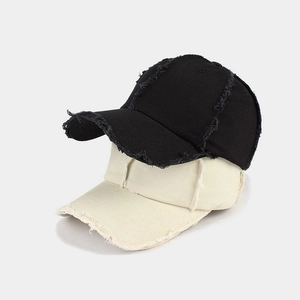 Black and beige frayed baseball caps set with vintage distressed details and soft crown
