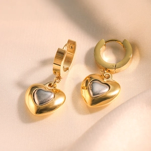 Minimalist gold-plated heart drop earrings with grey enamel inlay on beige silk