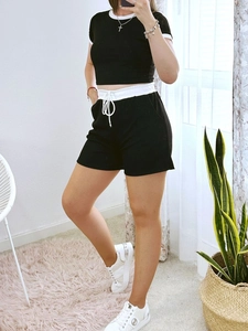 Women's two-piece casual set featuring a black short sleeve top and contrast trim shorts