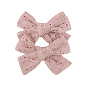 Set of two pink lace embroidery bow hair clips for kids with elegant floral patterns
