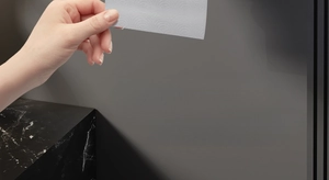 Close-up of tissue extraction and serrated bottom for easy paper cutting on holder