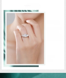 Detailed macro view of S925 silver three-stone ring with cushion-cut cubic zirconia