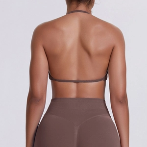 Detail of seamless backless halter sports bra in brown high-stretch yoga fabric