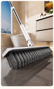 Detail of widened bathroom floor brush with gray bristles and durable stainless steel handle