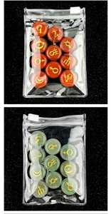 Macro view of solar system planet symbols engraved on polished gemstone rune stones