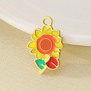 Macro shot of stainless steel sunflower pendant with red ladybug detail and golden edges