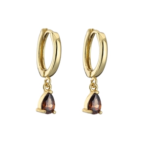 Close-up of gold drop earrings with pear-cut brown cubic zirconia and polished finish