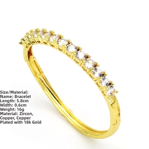 Detail of 18K gold plated bangle showing 5.8cm inner diameter and cubic zirconia inlay