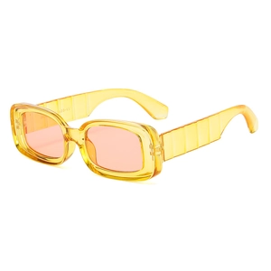 Fashionable rectangle sunglasses with yellow acetate frame and tinted peach lenses