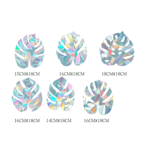 Detailed view of 6 monstera leaf rainbow prism window clings with size specifications
