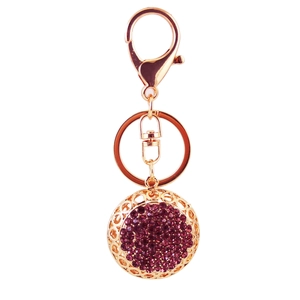 Creative gold metal keychain with purple rhinestones and hollow floral pattern pendant