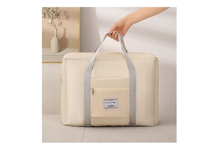 Macro detail of beige travel bag with quilted pattern and travel bag label