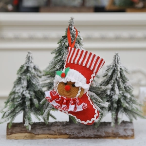 Christmas stocking with gingerbread man decor on festive fireplace mantel background
