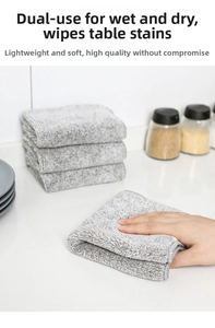Thick charcoal fiber dishcloth showing soft absorbent texture for kitchen cleaning task