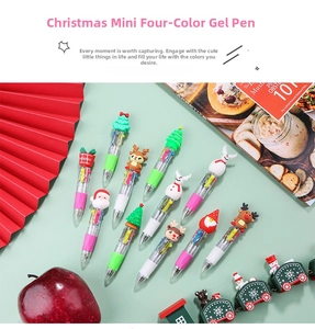 Close-up of festive Christmas mini 4-color ballpoint pens with cartoon holiday toppers