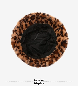 Detail of plush leopard bucket hat featuring black fabric lining and adjustable drawstring