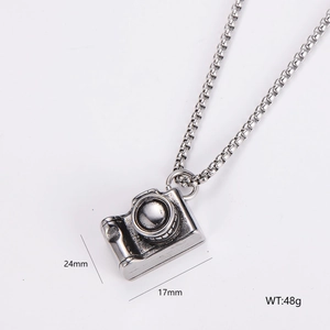 Detail view of retro silver camera pendant necklace with dimensions 24mm x 17mm and 48g weight